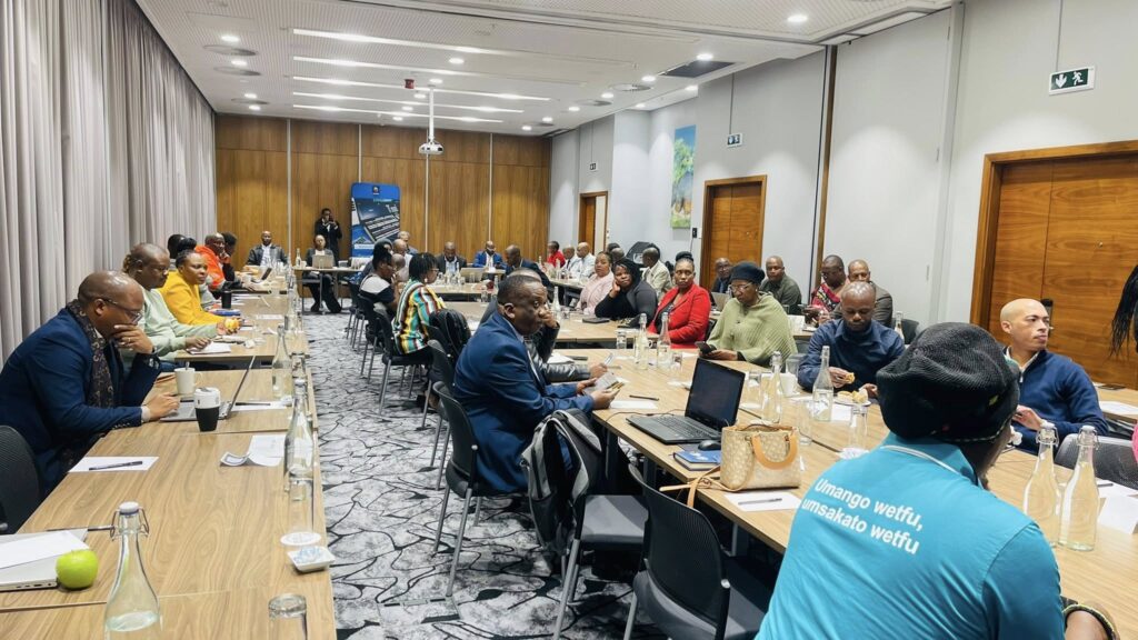 Delegates and stakeholders engaging in consultations with ESCCOM officials at the Hilton Garden Inn, discussing proposed broadcasting licence fees and raising concerns over the suggested pricing model.