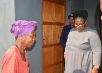 Gogo Nicholine Thabitha Dvuba beams with joy as she steps into her new home after years of living in unsafe, storm-damaged conditions.