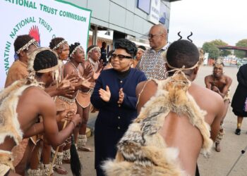 SAN Bushmen perform a traditional welcome dance alongside Minister of Tourism Jane Mkhonta-Simelane at the Ngwenya Border Post during their arrival for a cultural exchange visit in Eswatini.