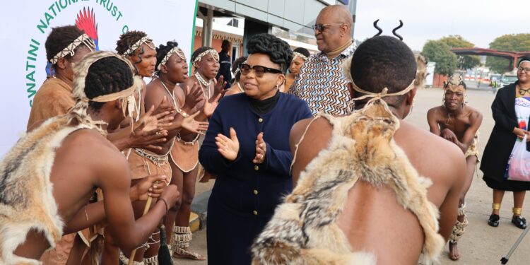 SAN Bushmen perform a traditional welcome dance alongside Minister of Tourism Jane Mkhonta-Simelane at the Ngwenya Border Post during their arrival for a cultural exchange visit in Eswatini.