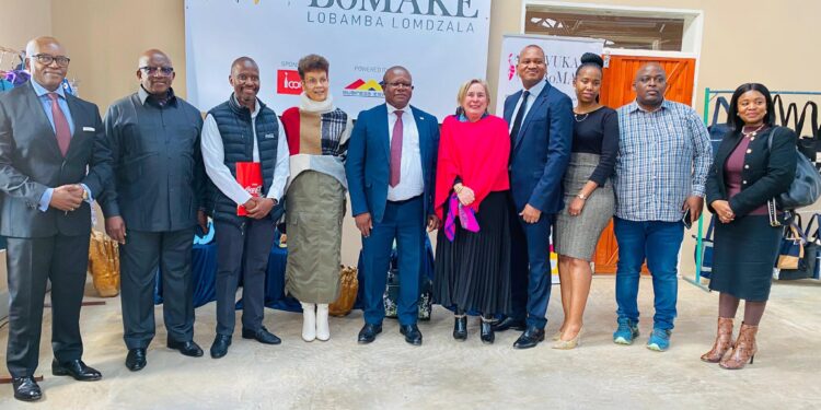 Minister of Commerce, Industry and Trade Manqoba Khumalo poses with members of the Vukani Bomake group, community leaders, and partners during the launch of the cottage factory in Lobamba Lomdzala.