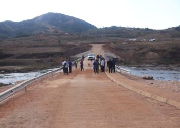 Community members of Mbangweni gather on the newly completed bridge connecting Nsingweni and Vusweni, officially opened by the Ministry of Economic Planning and Development under the Microprojects Programme.