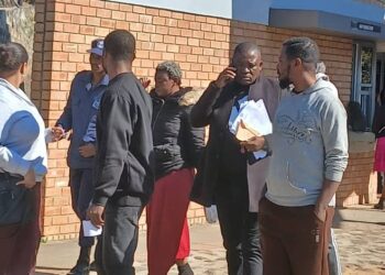 Some of the Ghanaian nationals being escorted from the Mbabane Magistrates Court by police officers. (Pics: Khulekile Mhlanga)