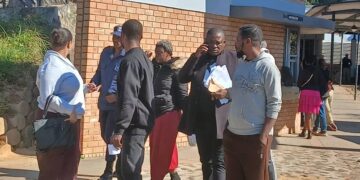 Some of the Ghanaian nationals being escorted from the Mbabane Magistrates Court by police officers. (Pics: Khulekile Mhlanga)