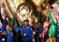 Chelsea players celebrate with the trophy after defeating Paris Saint-Germain to win the 2025 FIFA Club World Cup in New Jersey.