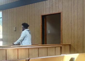 Vumani Mavuso standing in the dock at the Mbabane Magistrates Court where he faces theft charges.