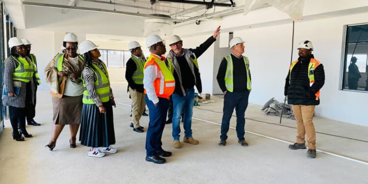 Minister Manqoba Khumalo inspects progress at the Jonnson Workwear factory site in Nhlangano ahead of its expected August handover.