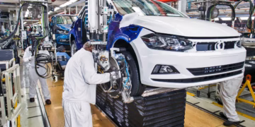 Technicians inspect a Polo sedan on the assembly line at Volkswagen’s Kariega plant in South Africa