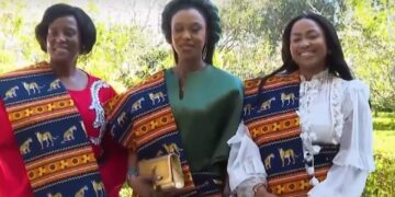 Her Majesty wrapped in traditional Mozambican attire after receiving gifts from First Lady Chapo — screengrab from video.