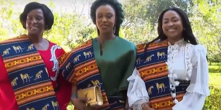 Her Majesty wrapped in traditional Mozambican attire after receiving gifts from First Lady Chapo — screengrab from video.
