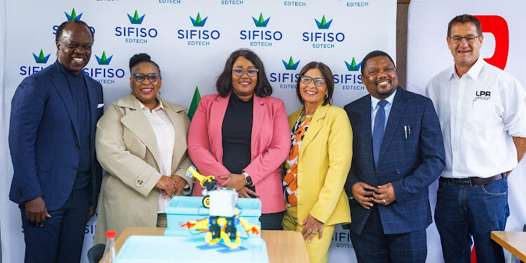 Sizwe Nxasana, left, Lutho Kota (Eastern Cape education department), Nandi Matomela (Isuzu SA), Helma Boggenpoel (principal of Astra Primary), Mawonga Blou (Astra Primary) and Allan Kanold (LPR Group). Image: Supplied