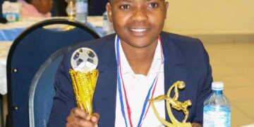 Welile Wewe Ndwandwe holding her trophies for Player of the Month and Player of the Season at the 2024/25 end-of-season awards.