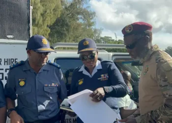 MK Party ex-combatant Lwazi Mzobe handing over the memorandum of demands to KZN Police Deputy Provincial Commissioner responsible for policing and operations Major General Phumelele Makoba. Picture: Nhlanhla Mabaso/ EWN.