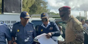 MK Party ex-combatant Lwazi Mzobe handing over the memorandum of demands to KZN Police Deputy Provincial Commissioner responsible for policing and operations Major General Phumelele Makoba. Picture: Nhlanhla Mabaso/ EWN.