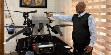 Former Ndzingeni MP Lutfo Dlamini demostrating how they will use the drone in their farming enterprise. (Pic; Supplied)