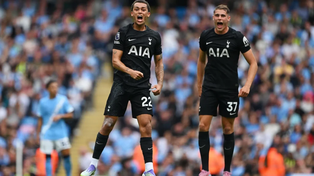 Spurs players celebrate after Brennan Johnson’s opener at the Etihad Stadium