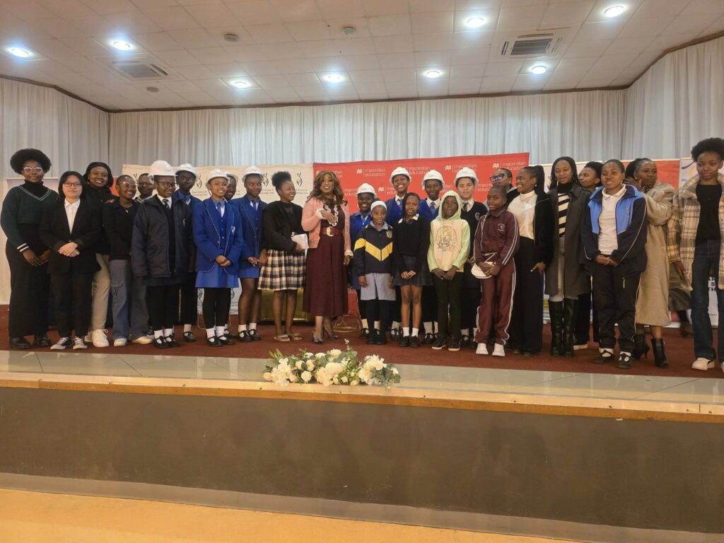 ICT Minister Savannah Maziya shares a moment with learners at the 2025 STEM Expo in Kwaluseni