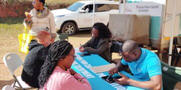A health official from the Ministry of Health attends to community members during the Makoti Indaba at Trumpet Assembly Church in Ezulwini.