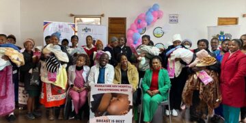 Breastfeeding mothers, healthcare workers, and ENNC officials pose for a group photo during World Breastfeeding Week celebrations at Mankayane Government Hospital.