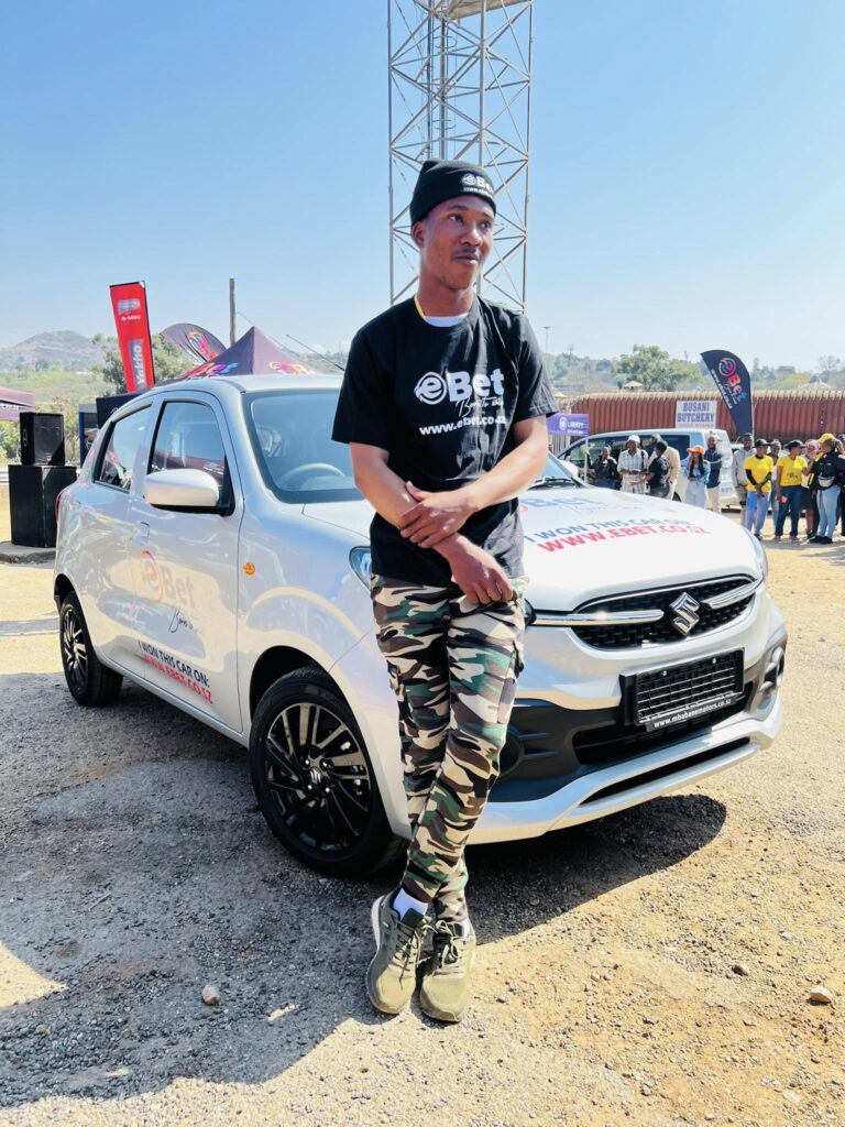 Thubelihle Sibandze, 21, from Ngwane Park, KaShali, poses proudly next to his new Suzuki Celerio.