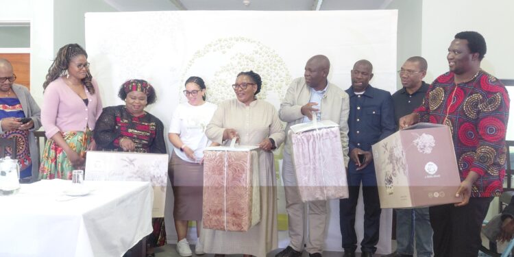 DPM Thulisile Dladla with officials carrying blankets for donation at Mankayane Old Age Home.