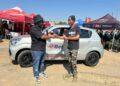 eBet CEO Bonginkhosi Lukhele hands over the Suzuki Celerio to winner Thubelihle Sibandze.
