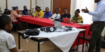 Young participants from 14 Red Cross units engage in discussions on disaster preparedness and community resilience in Manzini.
