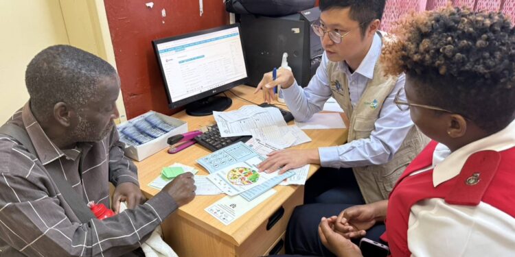 A health professional attends to a patient during the screening exercise at Horo Clinic in northern Hhohho.