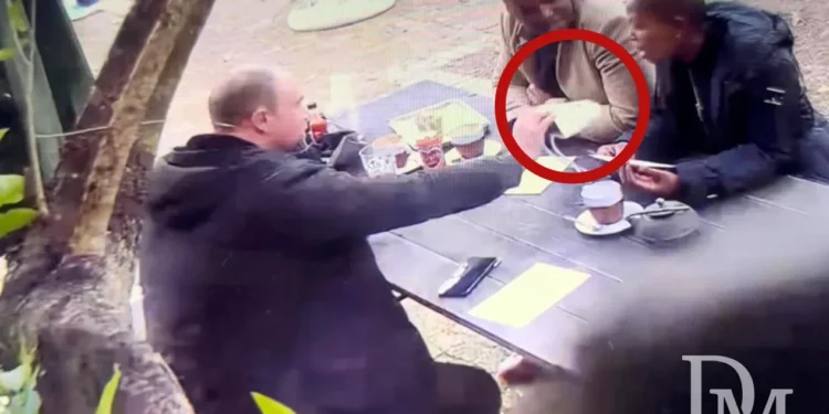 Exclusive video: Daily Maverick journalist Pieter-Louis Myburgh hands back R60,000 in cash to suspended IDT CEO Tebogo Malaka and IDT spokesperson Phasha Makgolane, who offered the money to quash a corruption investigation. (Screengrab: Daily Maverick)
