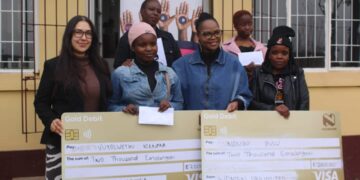 The four women entrepreneurs pose with Amanda Rodriguez and Women Unlimited staff after receiving E2,000 each to support their businesses in Mbabane.