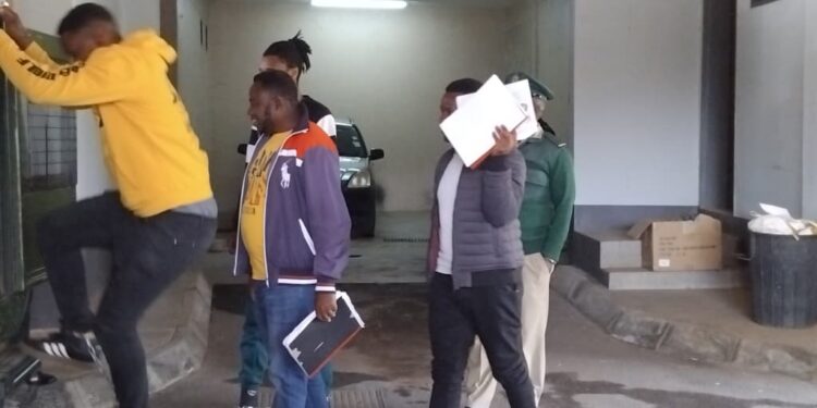 ATM bombing suspects boarding HMCS vehicle after a brief appearance in court. | Pic: Sithembiso Sihlongonyane