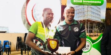 Senzo Fakudze celebrates after winning the BOAD National Darts Championships singles title at Elangeni High School.