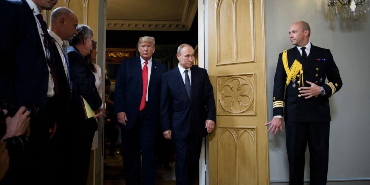 US President Donald Trump and Russia's President Vladimir Putin arrive for a meeting at Finland's Presidential Palace in Helsinki, Finland, on July 16, 2018. Brendan Smialowski/AFP/Getty Images/FILE