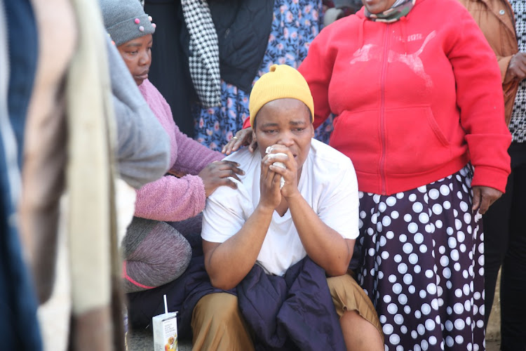 A family member of the e-hailing driver who was murdered at Maponya Mall was comforted at the scene of the crime on Thursday morning.
Image: Kabelo Mokoena