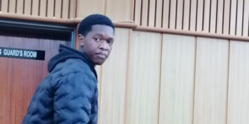 Siyandziswa Simelane listens to proceedings at the Mbabane Magistrates Court after pleading guilty to dagga possession.