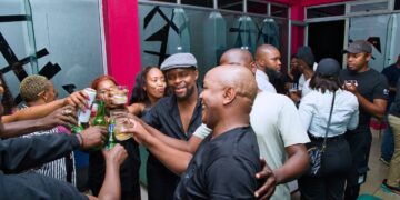Guests and performers enjoying the 2024 All Black Party at 23:28 Lounge in Mbabane, featuring local DJs, comedians, and visiting South African actors.