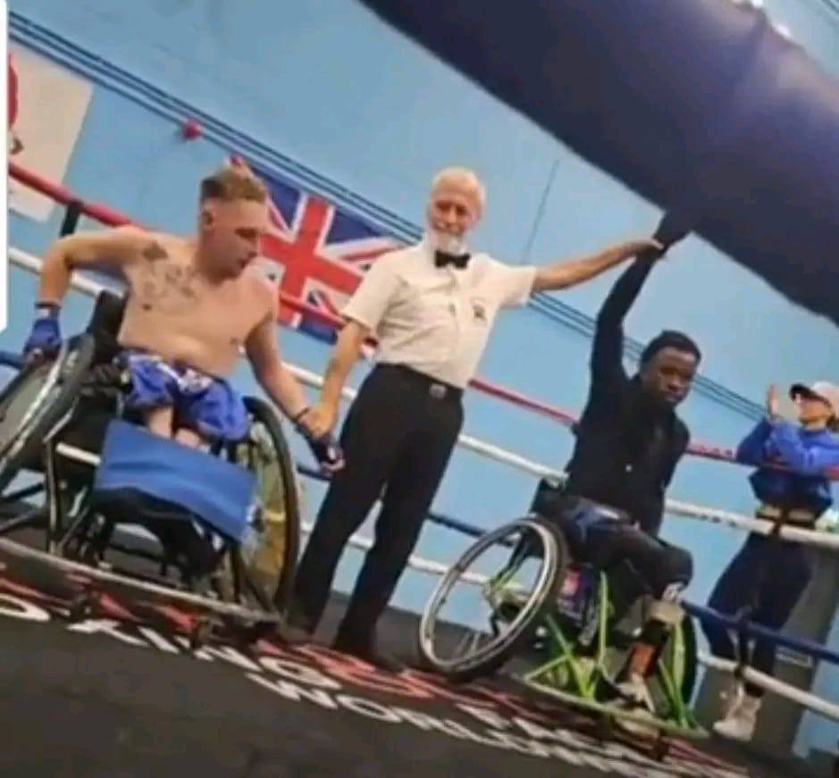 Tony Adebayo Adesanya celebrates his World Adaptive Boxing Championship victory with runner-up Danny Higgins at Market Harborough Leisure Centre.