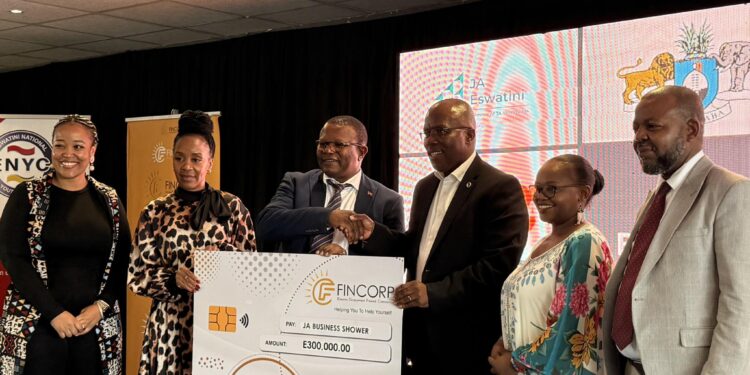 Minister of Commerce, Industry and Trade presents a cheque to Junior Achievement Eswatini officials during the launch of the Eswatini Business Shower 2025 at the Eswatini International Trade Fair.