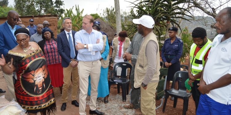 DPM Thulisile Dladla with Phillip Morris International executives during a visit to Ntombi Zulu’s homestead at Mlindazwe, where new houses for vulnerable families are under construction.