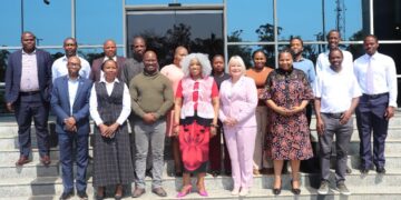 Hon. Minister Savannah Maziya, Senator and Minister of Information, Communications and Technology, poses with the seven developers who completed the Amazon Web Services training at the Royal Science and Technology Park during the closing ceremony in Matsapha.