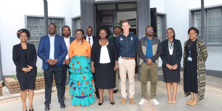 UNDP Resident Representative Henrik Franklin with judicial officers and correctional staff after observing virtual remand court proceedings at the Mbabane Magistrates Court.