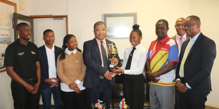 UNESWA students from Mbabane and Luyengo campuses present their 2025 Enactus National Championship trophies to Vice Chancellor Dr. M. Dlamini at Kwaluseni on 18 September 2025.