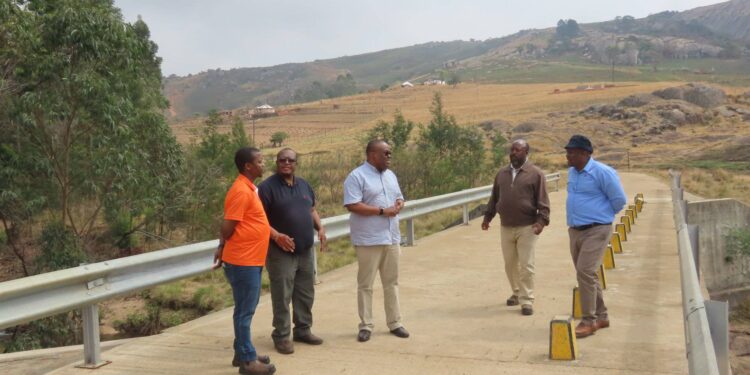 Public Works officials and community leaders inspect the Gobholo bridge during the Hhohho road assessment exercise.