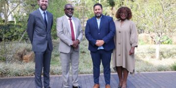 World Vision Eswatini National Director Amos Zaindi, Operations Director Sakhile Dlamini, U.S. Embassy Charge d’Affaires Marc A. Weinstock, and Political Economic Officer Allen C. Hodges meet in Ezulwini to discuss community development partnerships. Photo by World Vision Eswatini