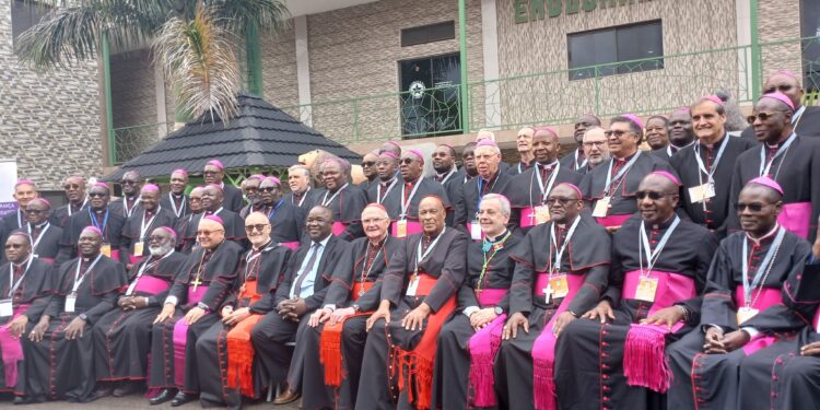 Minister Owen Nxumalo seated with Catholic clergymen during the Inter Regional Meeting of Bishops of Southern Africa at Esibayeni Lodge