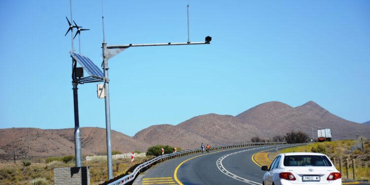 A car cruises past speed AOD cameras on a South African highway in the Western Cape