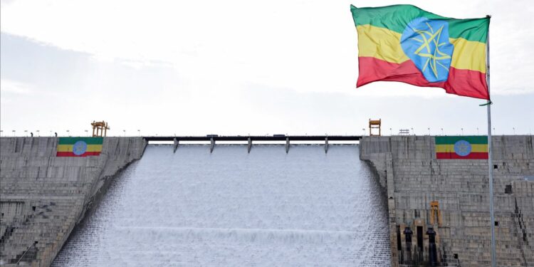 An Ethiopian flag flutters in the wind next to the Grand Ethiopian Renaissance Dam (GERD), built along the Blue Nile, during its inauguration, in Guba, Benishangul-Gumuz region, Ethiopia, September 9, 2025. REUTERS/Tiksa Negeri