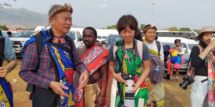 Some of the tourists who were captured wearing the Swazi attire at the Umhlanga Reed Dance. | Pics, Khulekile Mhlanga