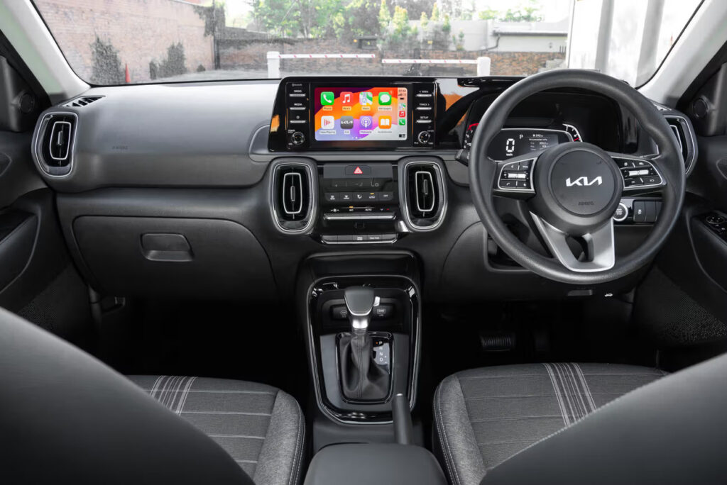 Interior: Modern cabin with infotainment screen and tech features for comfortable driving.