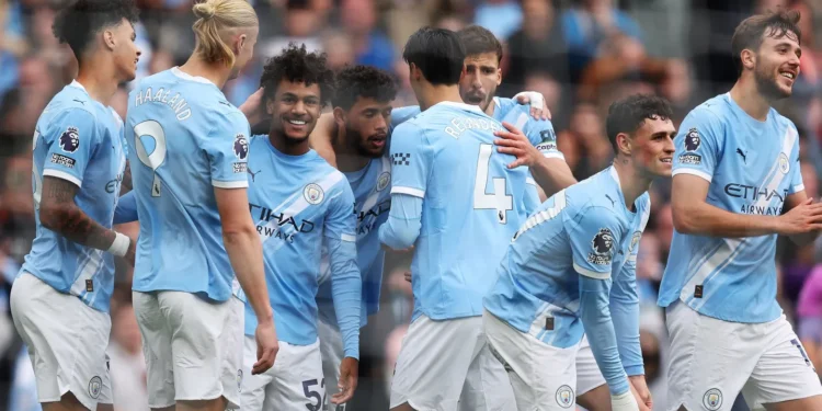 Manchester City players celebrate after taking the lead against Burnley at the Etihad Stadium on Saturday